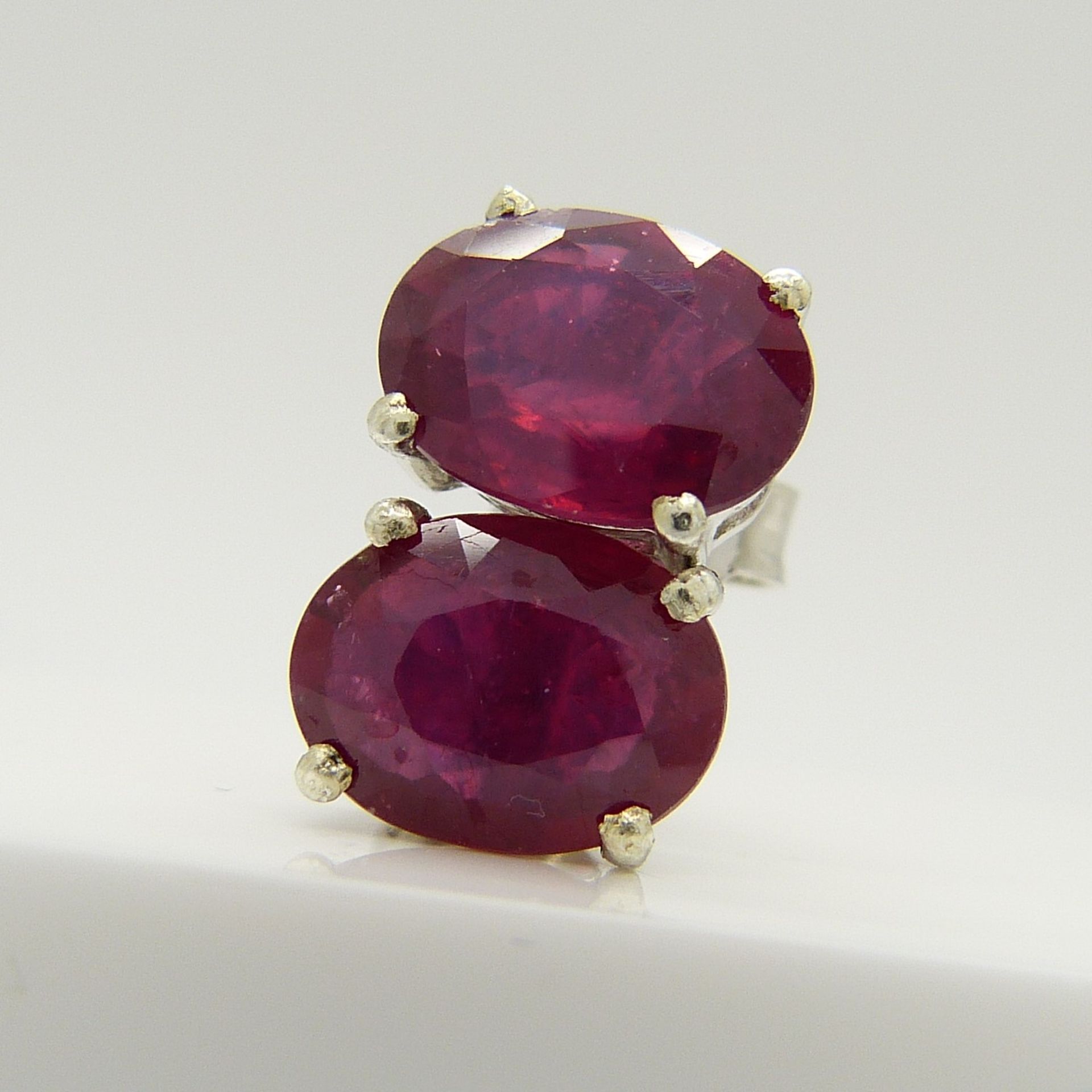 A pair of silver ear studs set with treated rubies, 1.70 carats (approx) - Image 4 of 5