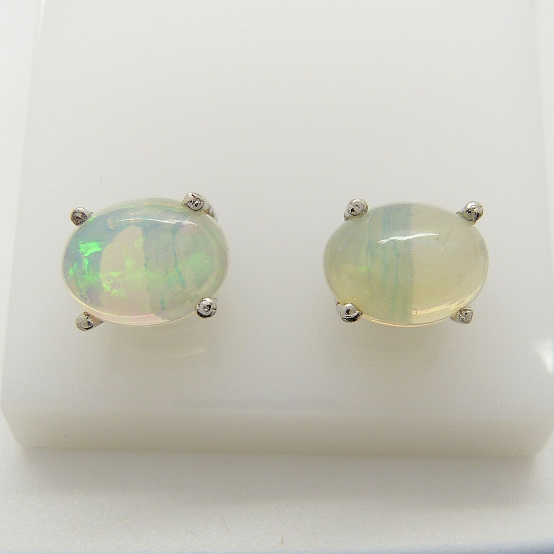 A pair of silver ear studs set with cabochon white opals, 1.30 carats (approx) - Image 3 of 5