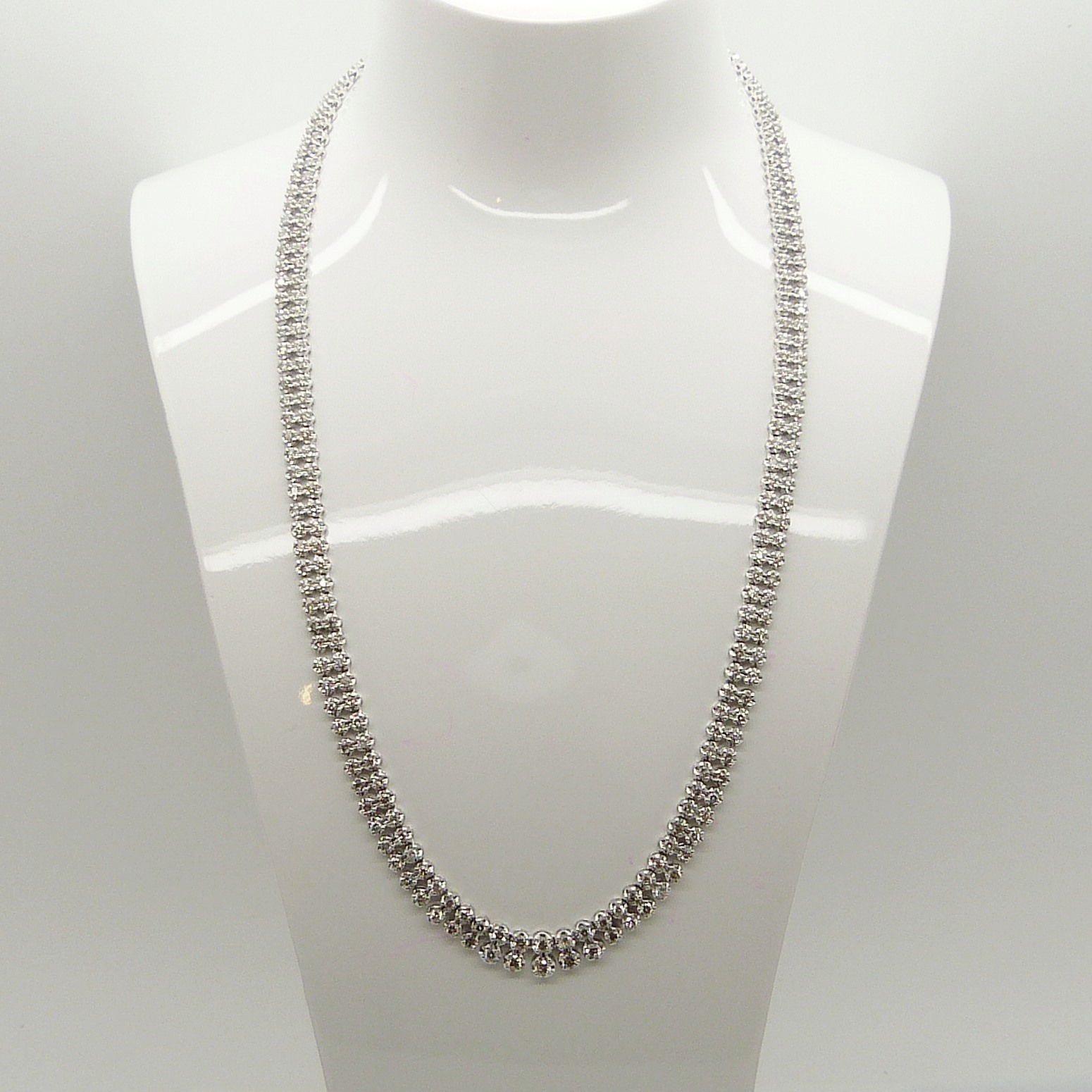 A superb, weighty 5.08 carat diamond Riviere double droplet-style necklace in platinum, boxed