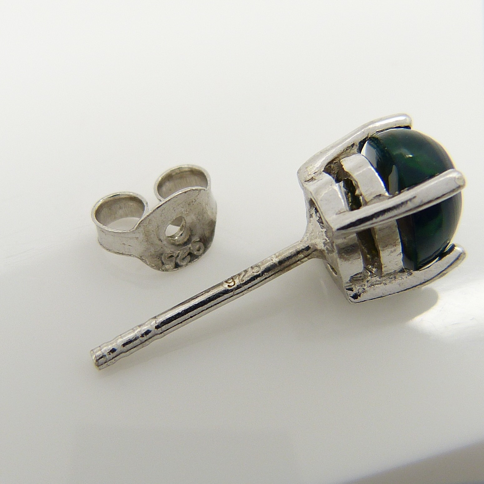 A pair of silver ear studs set with cabochon black Ethiopian opals, 1.10 carats (approx) - Image 5 of 5