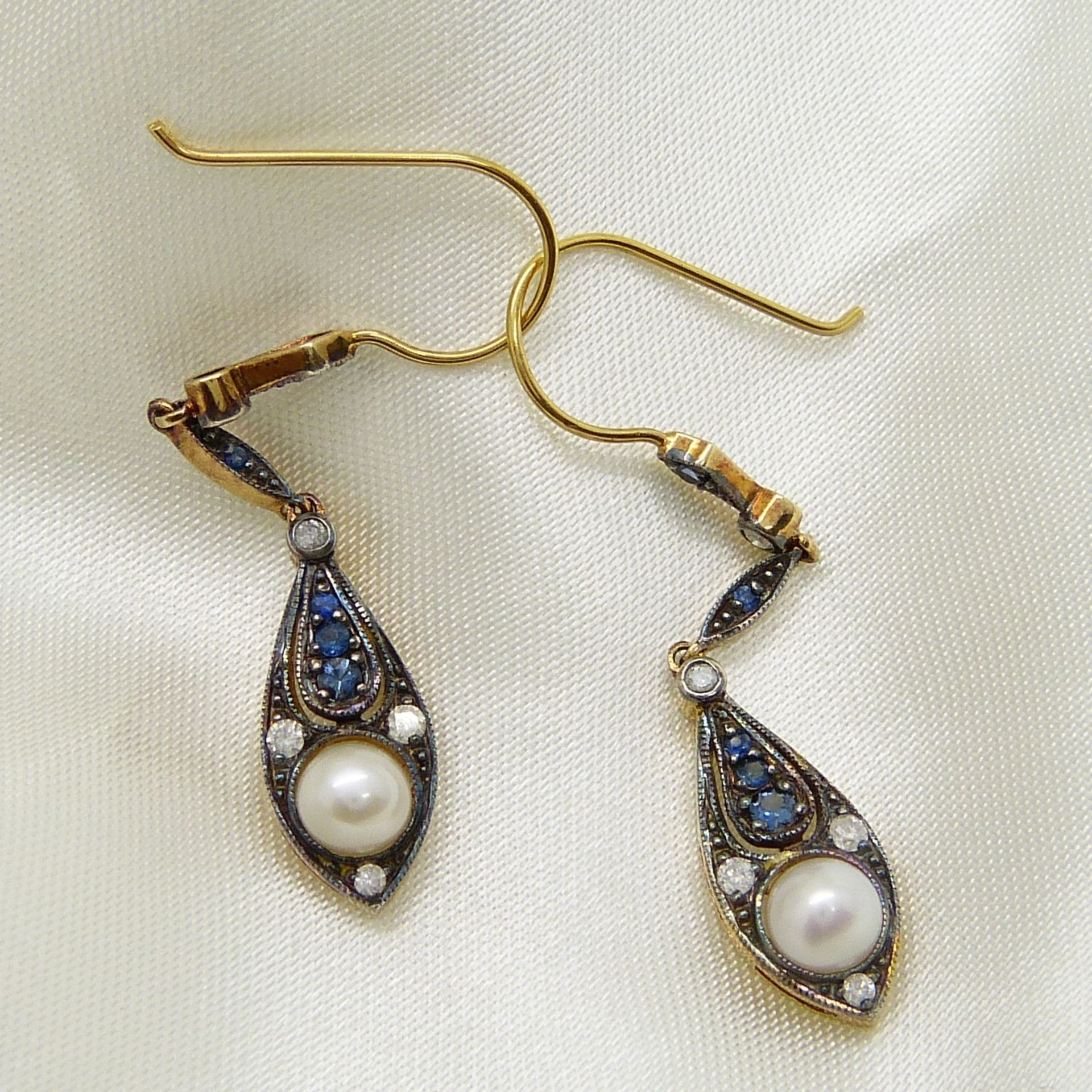 A boxed pair of vintage-style cultured pearl, sapphire and diamond drop earrings