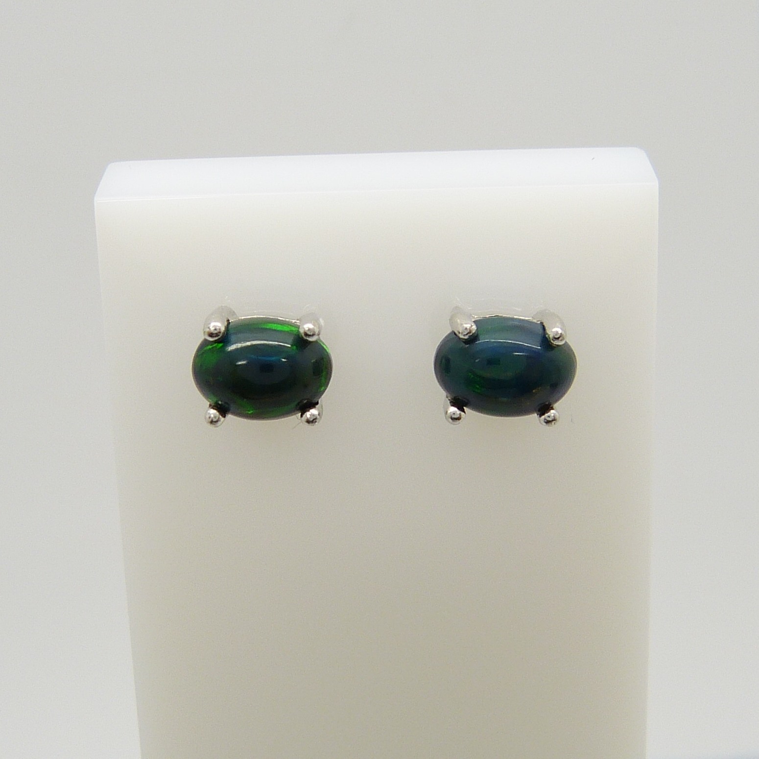 A pair of silver ear studs set with cabochon black Ethiopian opals, 1.10 carats (approx) - Image 4 of 5