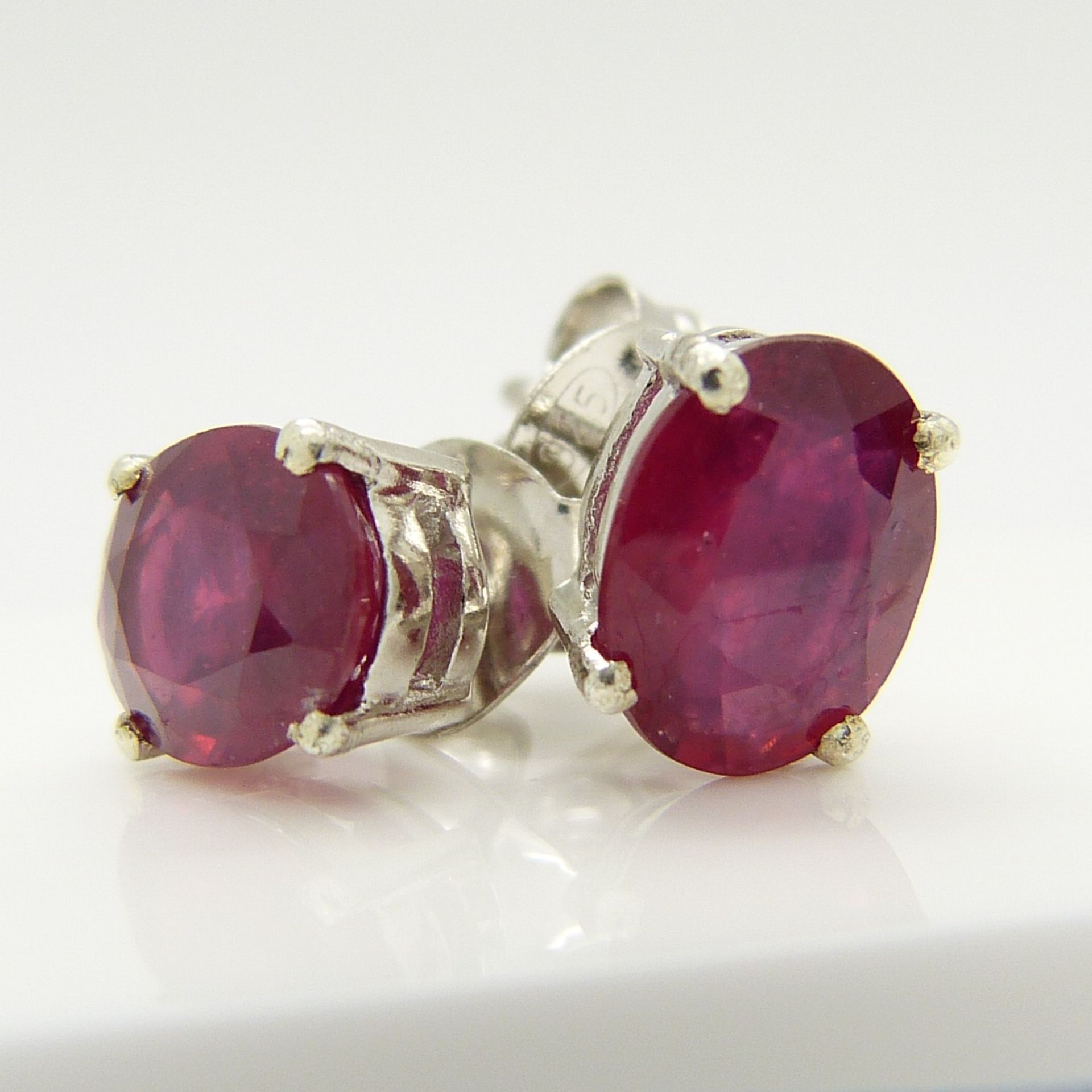 A pair of silver ear studs set with treated rubies, 1.70 carats (approx) - Image 2 of 5
