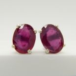 A pair of silver ear studs set with treated rubies, 1.70 carats (approx)