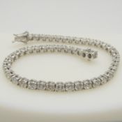 A stunning 7.25 carat diamond line bracelet in 18ct white gold, boxed