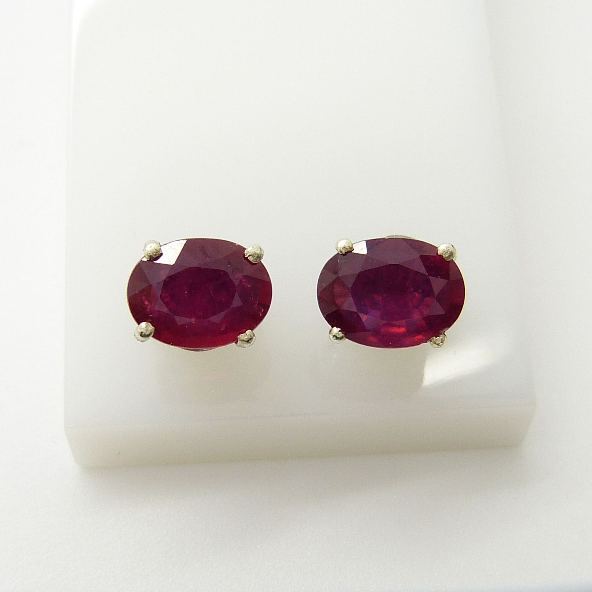 A pair of silver ear studs set with treated rubies, 1.70 carats (approx) - Image 3 of 5