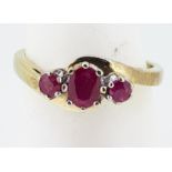 9ct (375) Yellow Gold Oval & Round Three Stone Ruby Crossover Ring