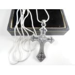 Silver necklace with pendant cross.