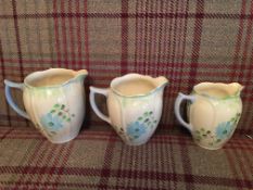 Set of 3 hand painted Art Deco graduated jugs