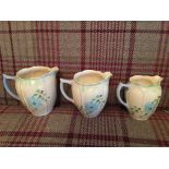 Set of 3 hand painted Art Deco graduated jugs