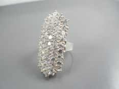 Silver ring with white stones.