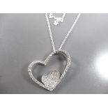 Silver necklace with heart pendant.