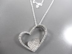 Silver necklace with heart pendant.