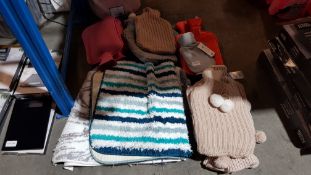 A Quantity Of Hot Water Bottles & Bath Mats