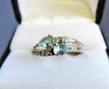 Sterling Silver Blue & White Topaz Crossover Ring