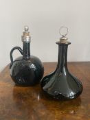 Two Victorian wine bottles with white metal stoppers