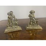 Pair of brass ornaments