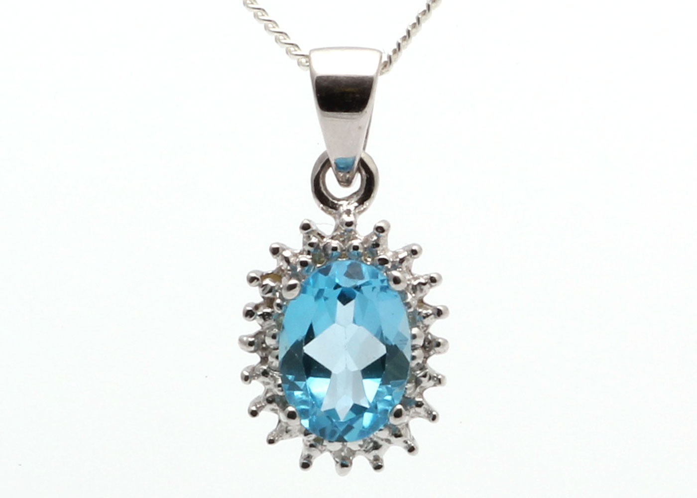 9ct White Gold Diamond And Blue Topaz Pendant