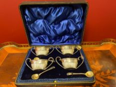 Set Of Four Boat Shape Silver Salts With Looped Handles And Four Silver Spoons.