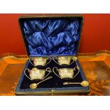 Set Of Four Boat Shape Silver Salts With Looped Handles And Four Silver Spoons.