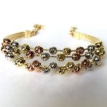 21 cm (8.3 in) Italian Dorica Beads Bracelet. In 14K Tri Colour White Yellow and Rosegold