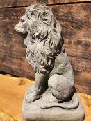 Large an ornate freestanding lion on a plinth