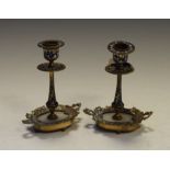 Pair of Continental gilt metal champlevé and alabaster candlesticks,