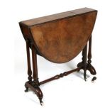 A Victorian figured walnut oval Sutherland table on turned supports