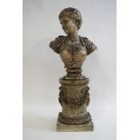 A 19th century Continental painted pottery bust of a woman on a socle and carved wooden column