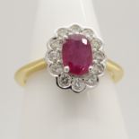 An 18ct yellow gold oval-cut ruby and round brilliant-cut diamond cluster ring.