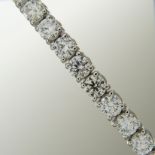 A stunning 7.25 carat diamond line bracelet in 18ct white gold, boxed.