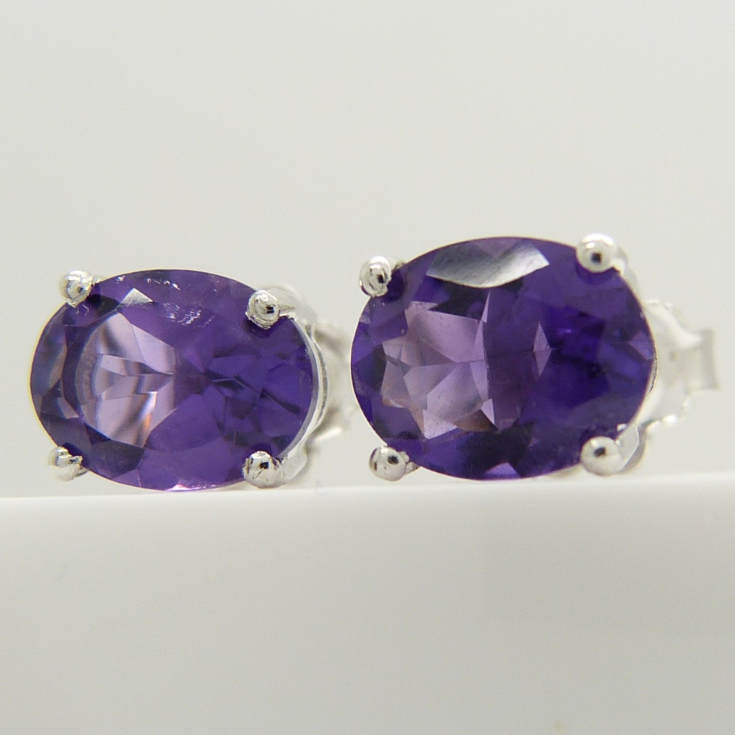 A pair of oval-cut 2.00 carat amethyst gemstone studs, in silver. - Image 4 of 5