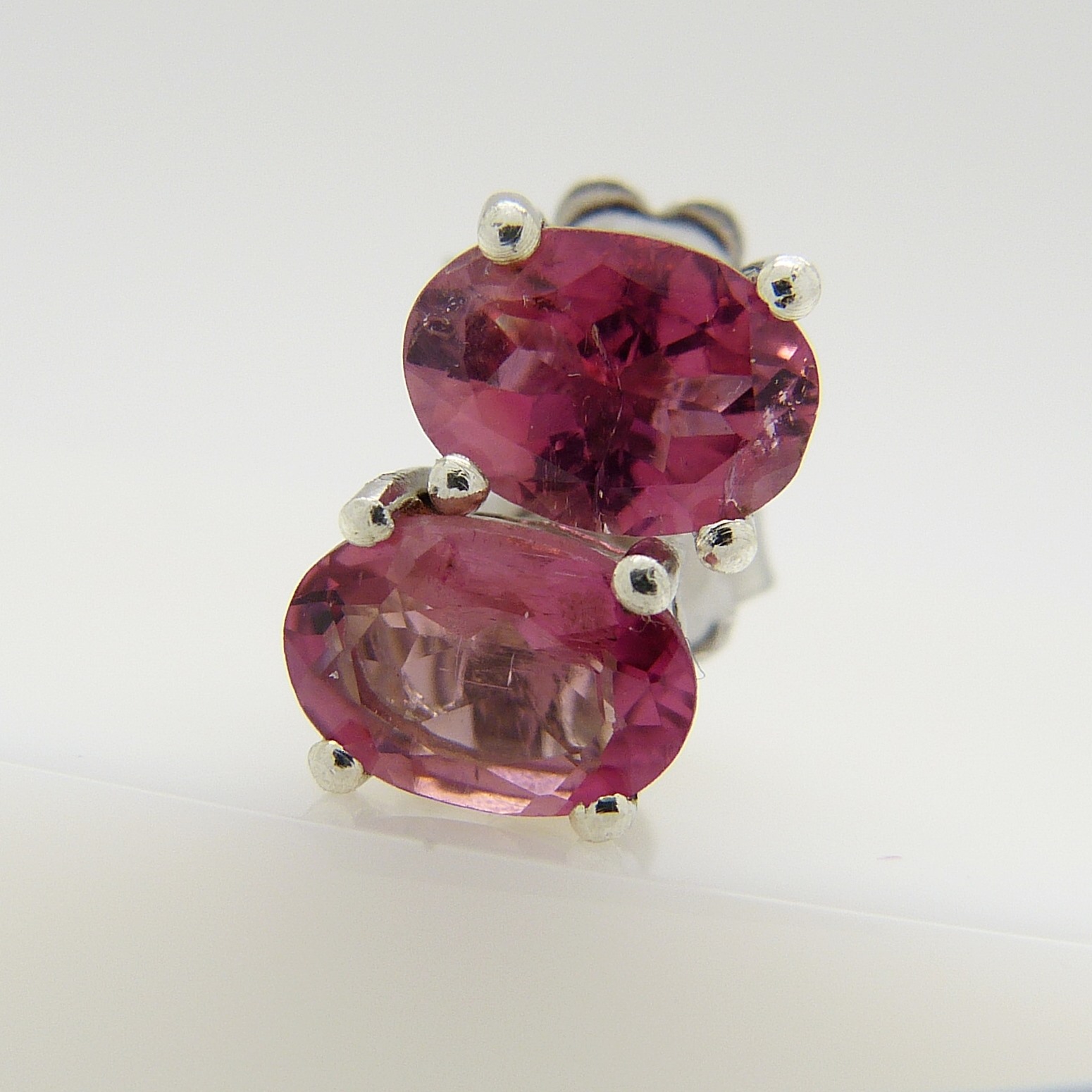 A pair of silver ear studs set with pink tourmalines, 1.30 carats (approx).