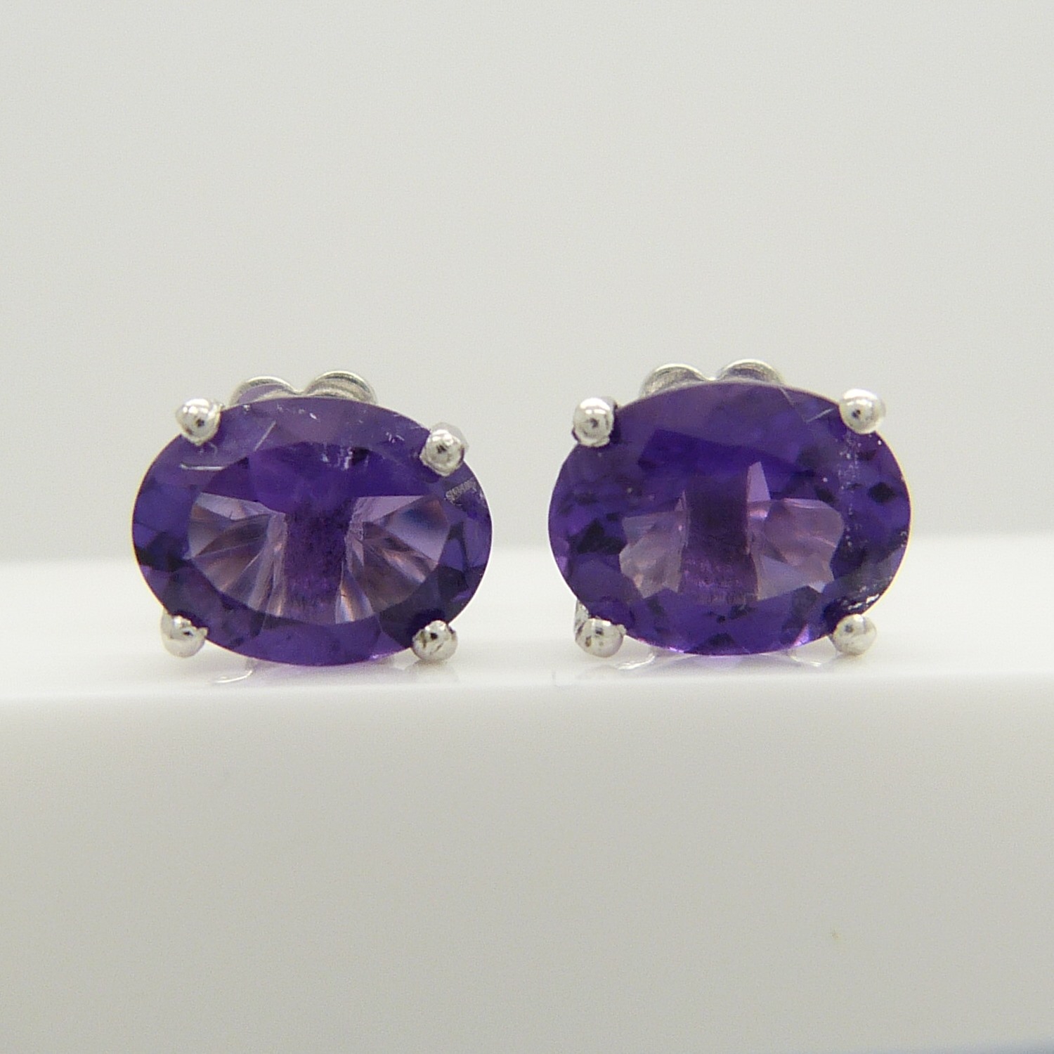 A pair of oval-cut 2.00 carat amethyst gemstone studs, in silver. - Image 3 of 5