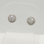 A pair of 0.36 carat diamond halo stud earrings in 18ct white gold, with presentation box.
