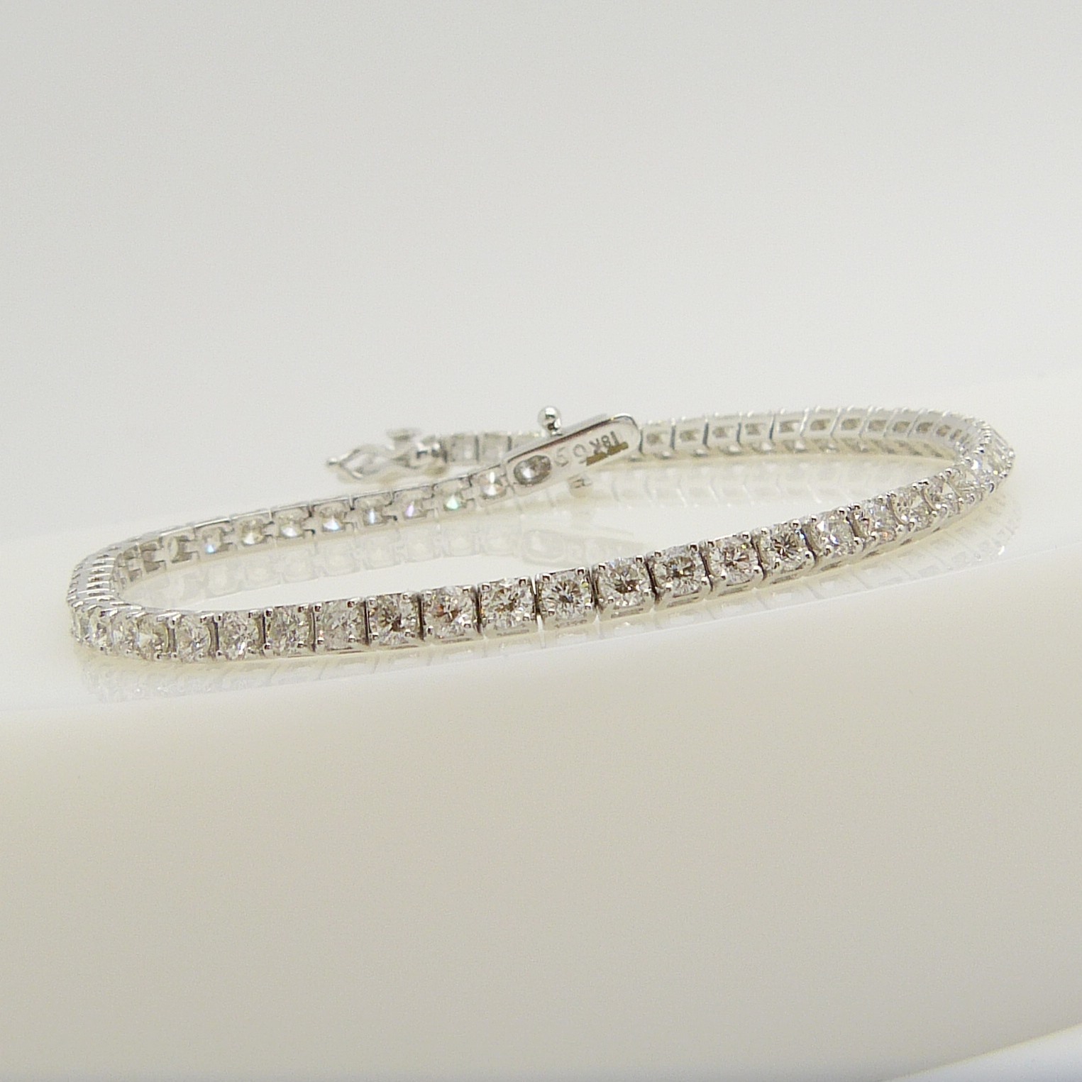 A stunning 18ct white gold 4.00 carat round brilliant-cut diamond line bracelet, boxed.