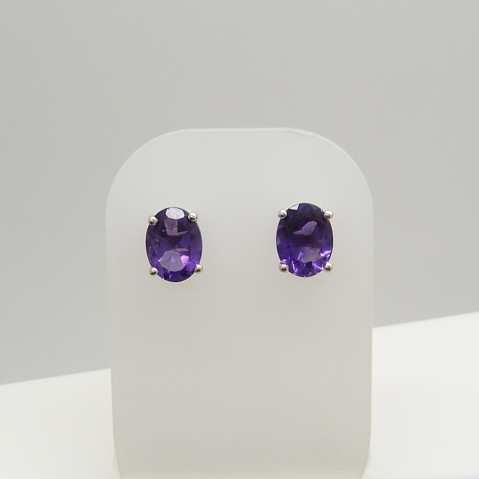 A pair of oval-cut 2.00 carat amethyst gemstone studs, in silver. - Image 2 of 5