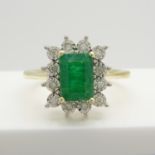 An attractive 9ct yellow gold rectangular emerald and diamond cluster ring.