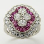 A large and stylish quatrefoil-shaped platinum ruby and old-cut diamond cocktail ring.