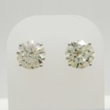 Large pair of dazzling 4.12 carat round, brilliant-cut diamond solitaire studs in 18ct white gold