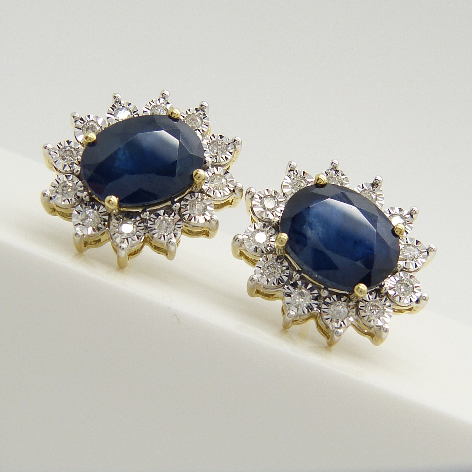 A stunning pair of 9ct yellow gold treated blue sapphire and diamond cluster ear studs, boxed. - Image 2 of 5