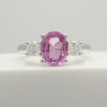 18ct white gold oval-cut pink sapphire and round brilliant-cut diamond dress ring.