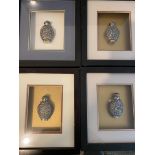 Four Framed White Metal perfume Bottles