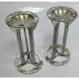 A PAIR OF CHARLES RENNIE MACKINTOSH PEWTER CANDLE HOLDERS