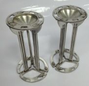 A PAIR OF CHARLES RENNIE MACKINTOSH PEWTER CANDLE HOLDERS