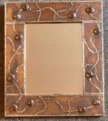 Handmade pewter mirror with amber coloured cabochons