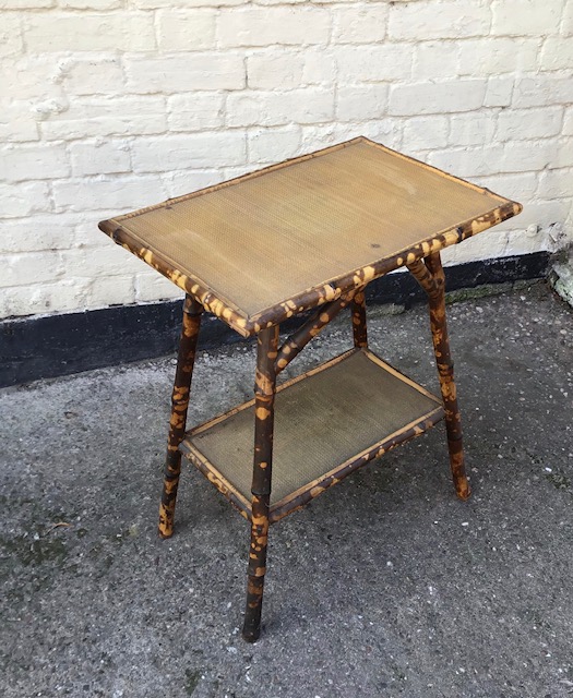 A vintage bamboo and rattan side table.