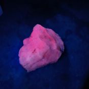 Collectable Fluorescent Mineral Glows Pink in The Dark