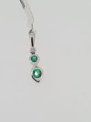 18ct hallmarked white gold emerald and diamond pendant