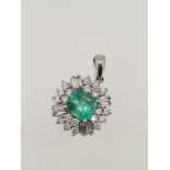 18ct white gold emerald and diamond pendant